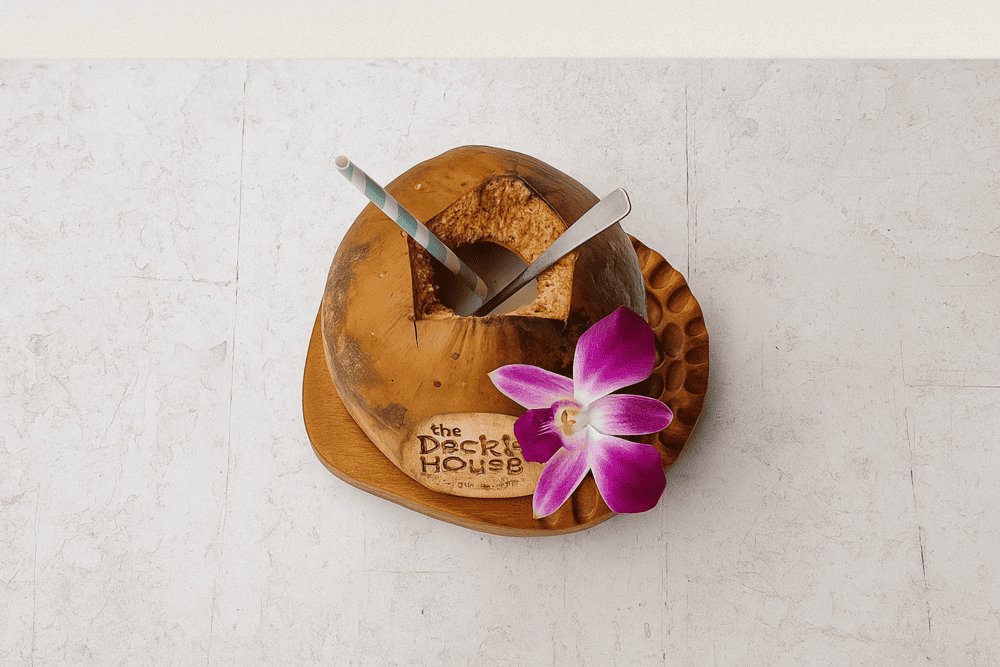 Don&rsquo;t miss the chilled coconut water engraved with &ldquo;The Deck House&rdquo;, refreshing and picture-perfect for your beachside snapshots